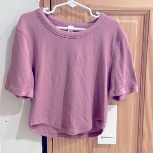 Lululemon size four Hold Tight Cropped T-Shirt brand new with tags.